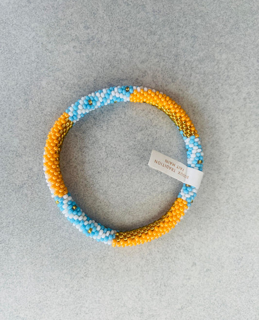 Bracelet népalais - orange clair bleu clair blanc et doré